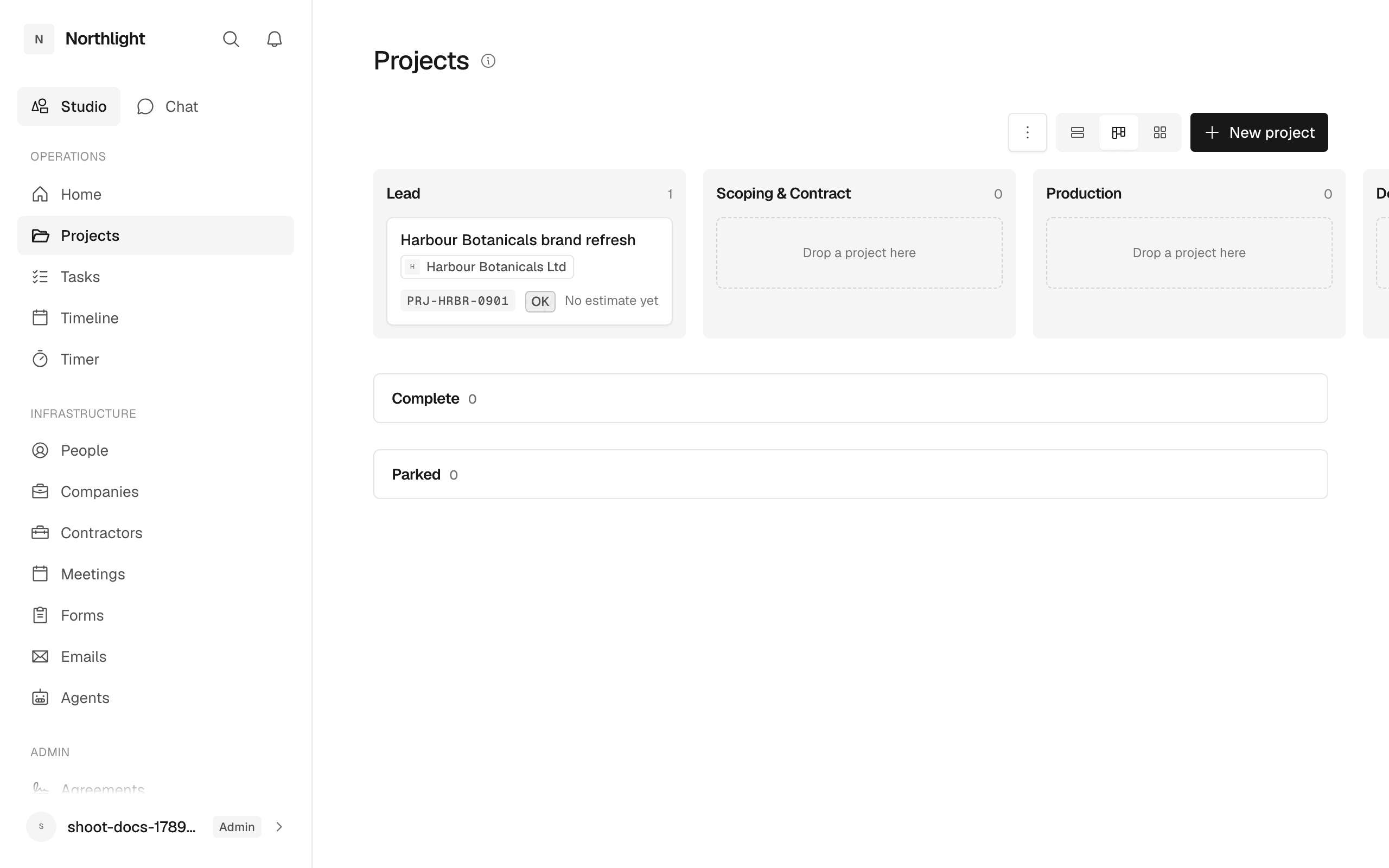 The Projects register in Board view: one column per open stage, with Complete and Parked collapsed underneath.